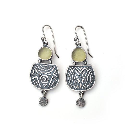 Etched silver earrings with olive green sea glass,  on a white background.